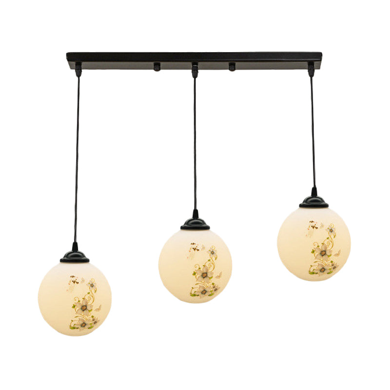 Black Sphere Multi Ceiling Lamp Modernism White Printing Glass 3-Light Dining Room Pendant with Round/Linear Canopy Clearhalo 'Ceiling Lights' 'Close To Ceiling Lights' 'Glass shade' 'Glass' 'Pendant Lights' 'Pendants' Lighting' 802344