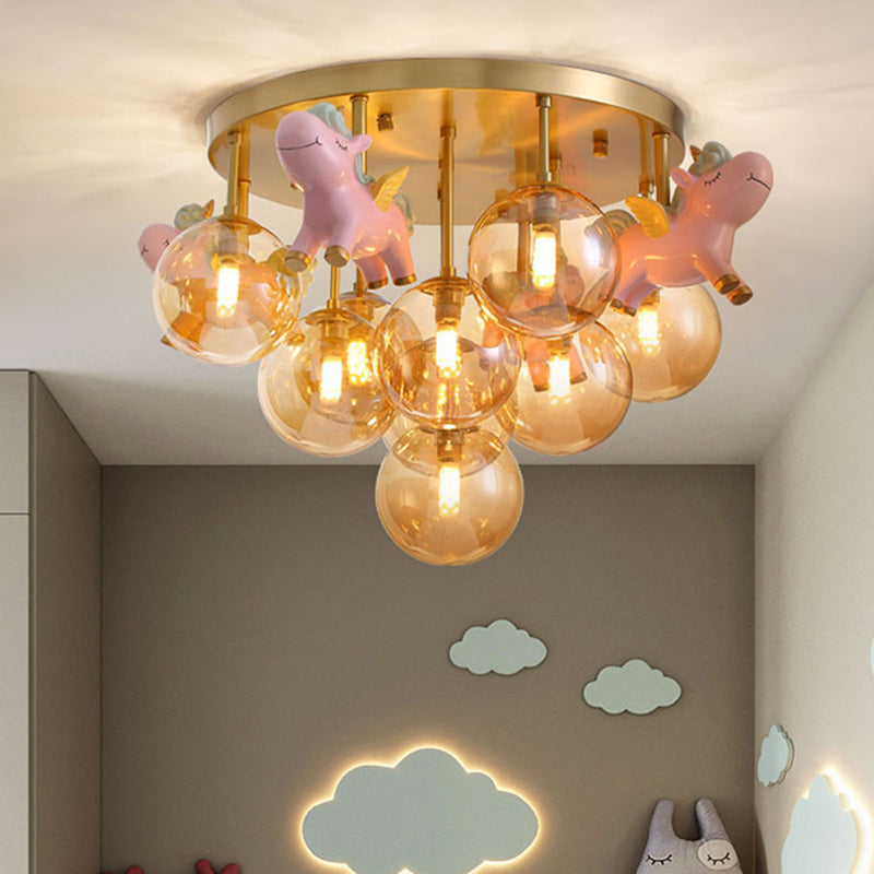 Metal Cartoon Pony Semi-Flush Mount Lamp Macaron 9 Heads Gold Ceiling Light Fixture with Globe Amber Glass Shade Gold Clearhalo 'Ceiling Lights' 'Close To Ceiling Lights' 'Close to ceiling' 'Semi-flushmount' Lighting' 809988