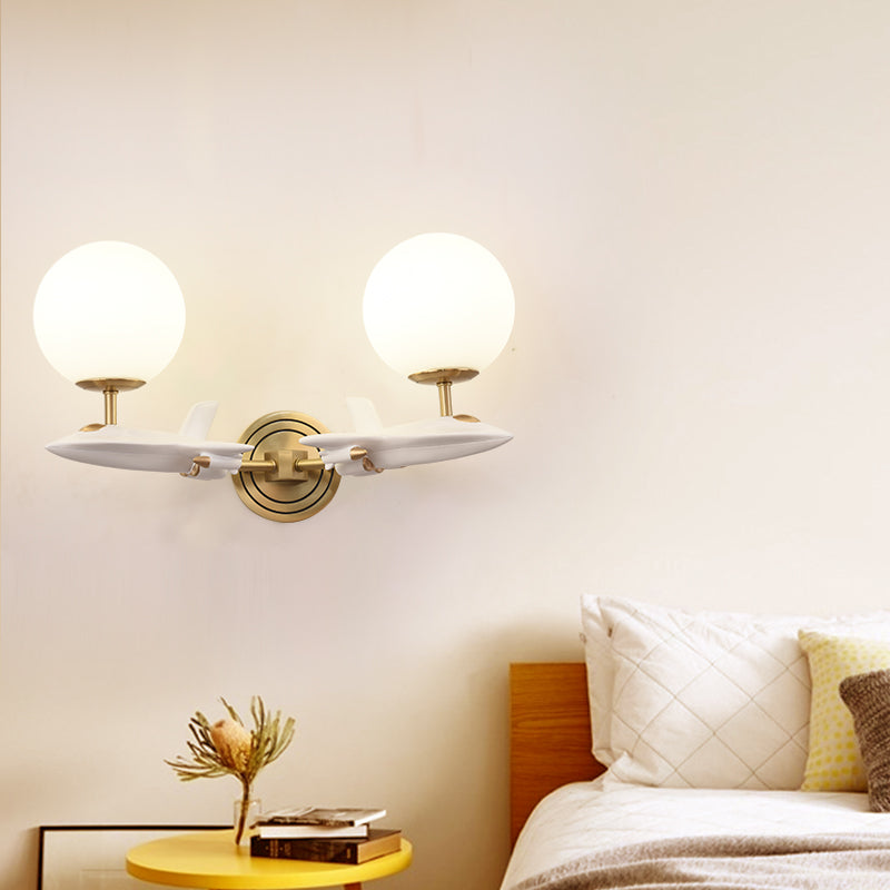 Kids Spaceship Shape Base Gold Wall Light Fixture 1/2 Bulbs Sconce Light with Globe Cream Glass Shade in White and Gold 2.0 White-Gold Clearhalo 'Wall Lamps & Sconces' 'Wall Lights' Lighting' 811498