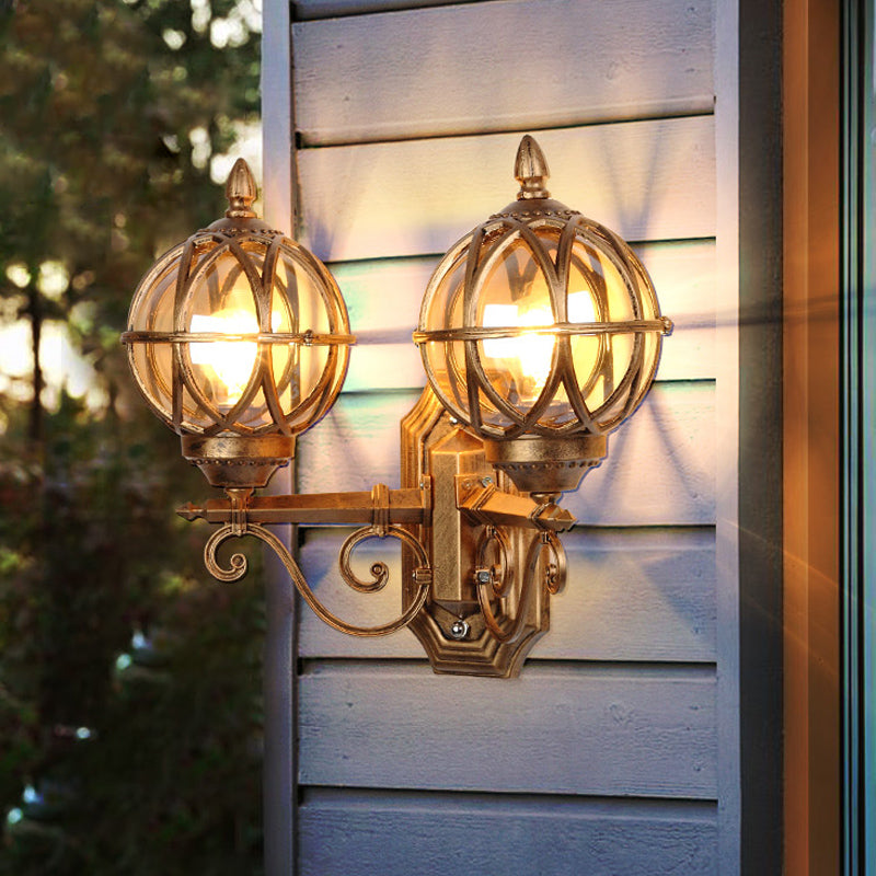 Black/Bronze Spherical Wall Lighting Ideas Country Amber Glass 2-Bulb Patio Surface Wall Sconce with Cage Bronze Clearhalo 'Wall Lamps & Sconces' 'Wall Lights' Lighting' 815074