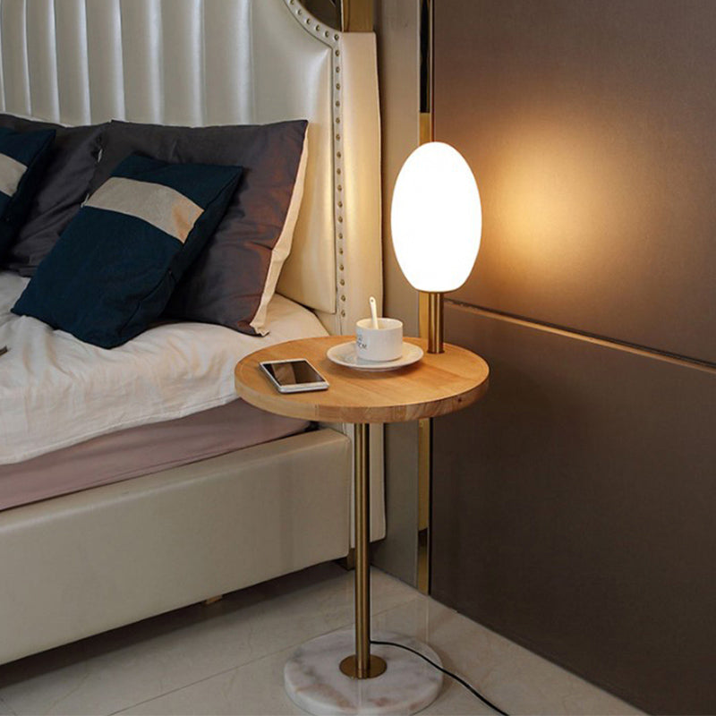 Cognac/White Glass Egg Shape Floor Lighting Modernist 1 Light Standing Floor Lamp with Wood Storage Board Clearhalo 'Floor Lamps' 'Lamps' Lighting' 863307