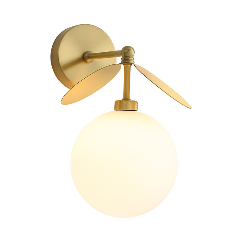 Post Modern Globe/Oval Wall Mount Lamp Cream Glass 1 Light Bedside Wall Light in Brass with Leaf Deco Clearhalo 'Cast Iron' 'Glass' 'Industrial' 'Modern wall lights' 'Modern' 'Tiffany' 'Traditional wall lights' 'Wall Lamps & Sconces' 'Wall Lights' Lighting' 875285