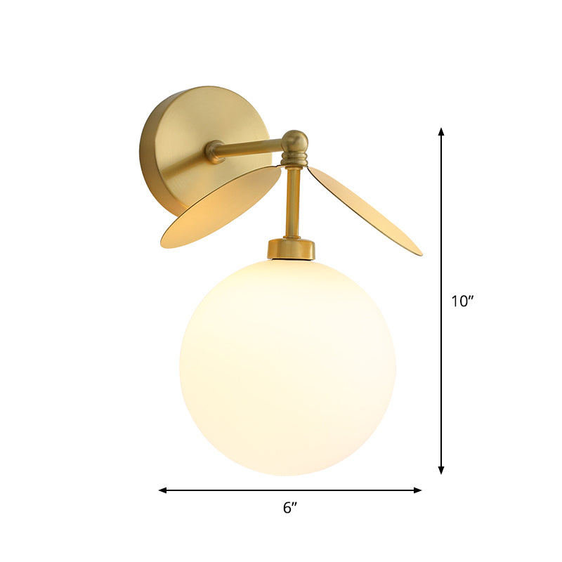 Post Modern Globe/Oval Wall Mount Lamp Cream Glass 1 Light Bedside Wall Light in Brass with Leaf Deco Clearhalo 'Cast Iron' 'Glass' 'Industrial' 'Modern wall lights' 'Modern' 'Tiffany' 'Traditional wall lights' 'Wall Lamps & Sconces' 'Wall Lights' Lighting' 875286