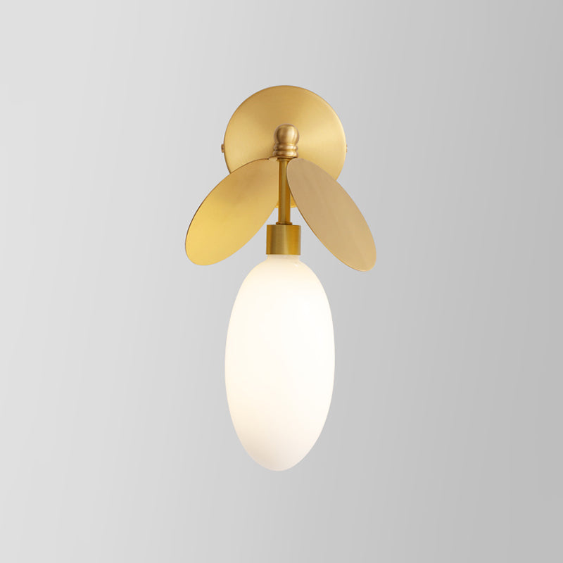 Post Modern Globe/Oval Wall Mount Lamp Cream Glass 1 Light Bedside Wall Light in Brass with Leaf Deco Clearhalo 'Cast Iron' 'Glass' 'Industrial' 'Modern wall lights' 'Modern' 'Tiffany' 'Traditional wall lights' 'Wall Lamps & Sconces' 'Wall Lights' Lighting' 875290