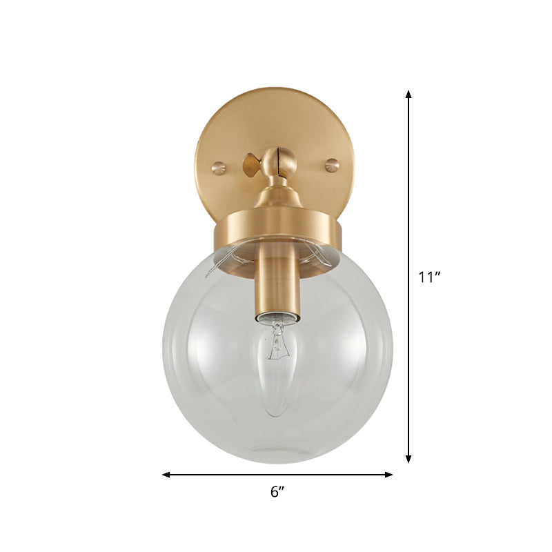 Modernist Ball Wall Mounted Lighting Clear Glass 1 Bulb Bedroom Rotatable Wall Lamp in Brass Clearhalo 'Cast Iron' 'Glass' 'Industrial' 'Modern wall lights' 'Modern' 'Tiffany' 'Traditional wall lights' 'Wall Lamps & Sconces' 'Wall Lights' Lighting' 875311