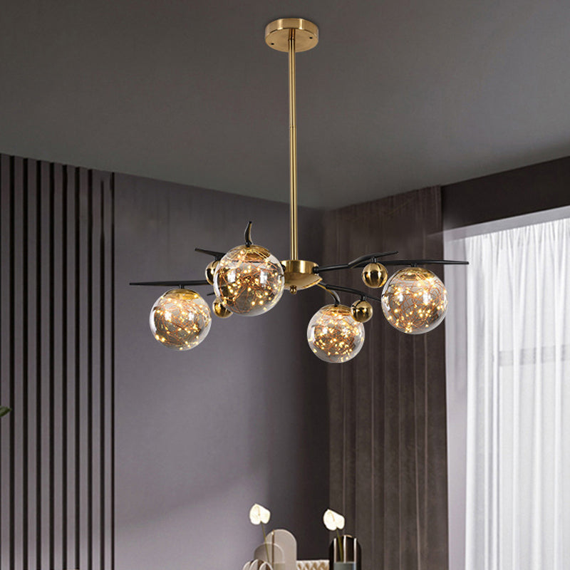 Brass Globe Chandelier with Glowworm Design Contemporary 4/6 Lights Smoke Gray Glass Radial Suspension Lamp 4 Brass Clearhalo 'Ceiling Lights' 'Chandeliers' 'Modern Chandeliers' 'Modern' Lighting' 875458