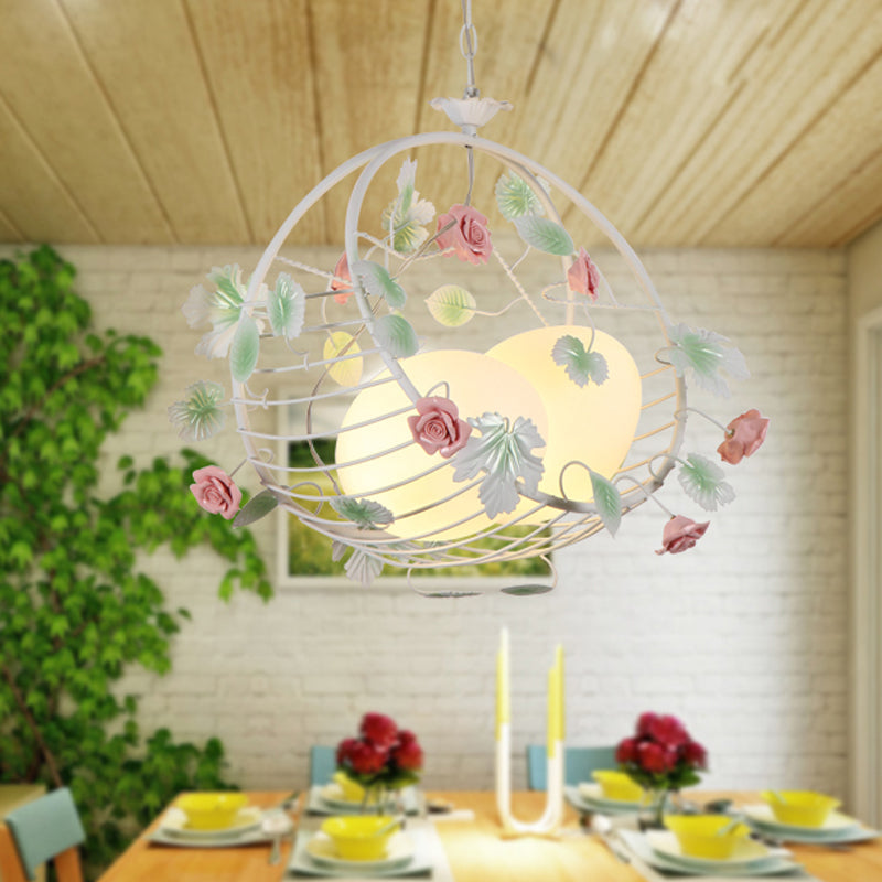 Swing Shaped Iron Hanging Lamp Korean Flower 2 Bulbs Dining Table Chandelier in Pink with Ball Glass Shade Clearhalo 'Ceiling Lights' 'Chandeliers' Lighting' options 882094