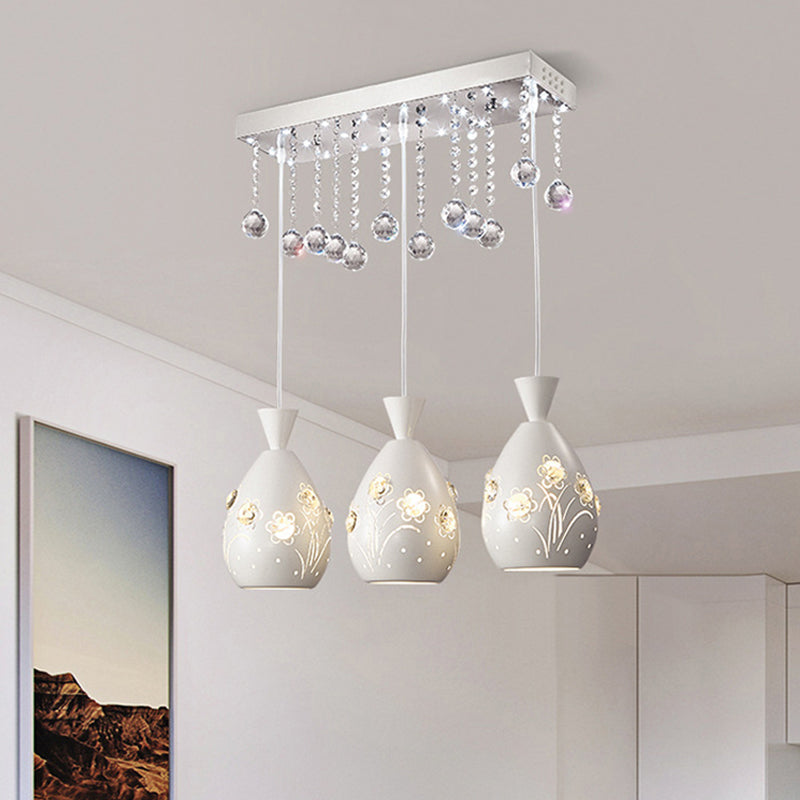 Hollow-Out Floret Iron Multi Light Ceiling Lamp Modern 3-Light White Hanging Pendant with Crystal Droplet White Clearhalo 'Ceiling Lights' 'Modern Pendants' 'Modern' 'Pendant Lights' 'Pendants' Lighting' 897589