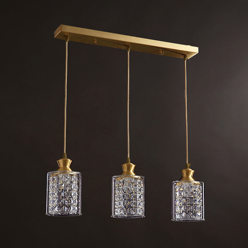 Cylinder Faceted Crystal Multi-Light Pendant Modernist 3 Heads Gold Hanging Lamp with Clear Glass Shade Clearhalo 'Ceiling Lights' 'Close To Ceiling Lights' 'Glass shade' 'Glass' 'Modern Pendants' 'Modern' 'Pendant Lights' 'Pendants' Lighting' 916249