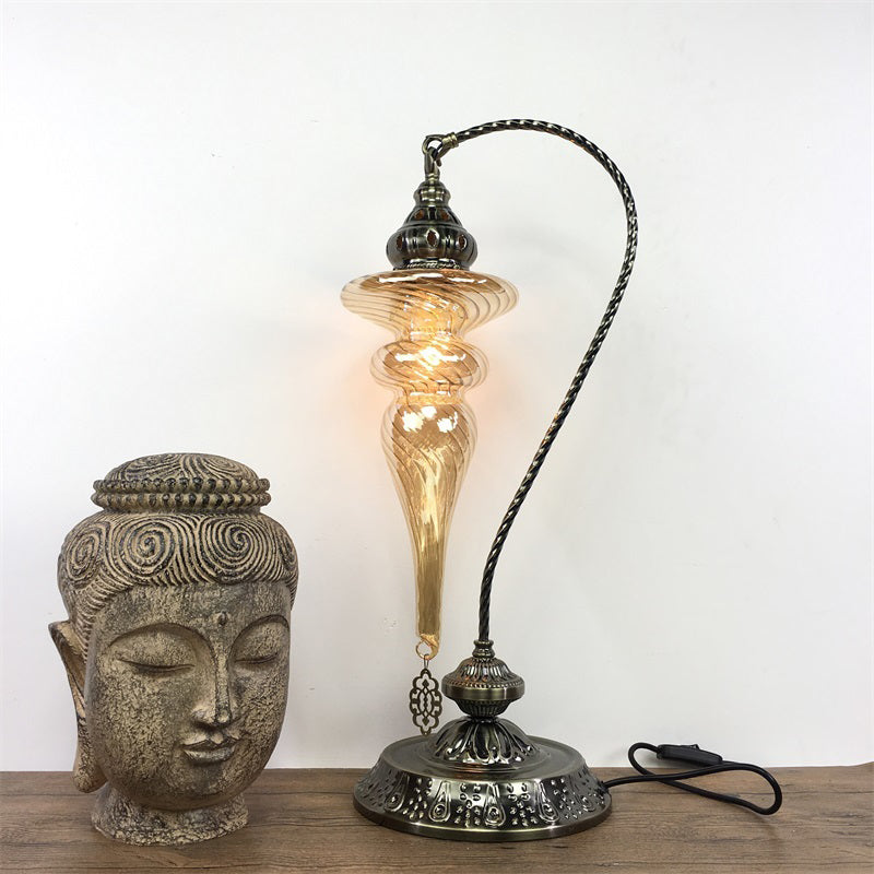 Brass/Gloss Black 1 Head Table Lamp Bohemia Amber Glass Oval/Urn Nightstand Lighting with Curved Arm Clearhalo 'Lamps' 'Table Lamps' Lighting' 920939