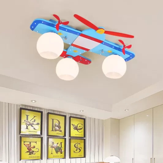 Propeller Airplane Nursing Room Ceiling Light Wood Glass 3 Lights Cute Flush Mount Light in Blue Clearhalo 'Ceiling Lights' 'Close To Ceiling Lights' 'Close to ceiling' 'Flush mount' Lighting' 92147