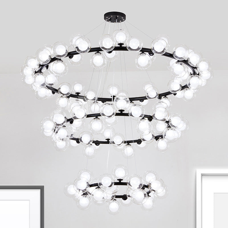 Bubble Chandelier Light Contemporary Clear Glass 2/3 Tiers Black Finish Hanging Lamp with Metal Ring for Living Room Clearhalo 'Ceiling Lights' 'Chandeliers' 'Glass shade' 'Glass' 'Modern Chandeliers' 'Modern' Lighting' 926402