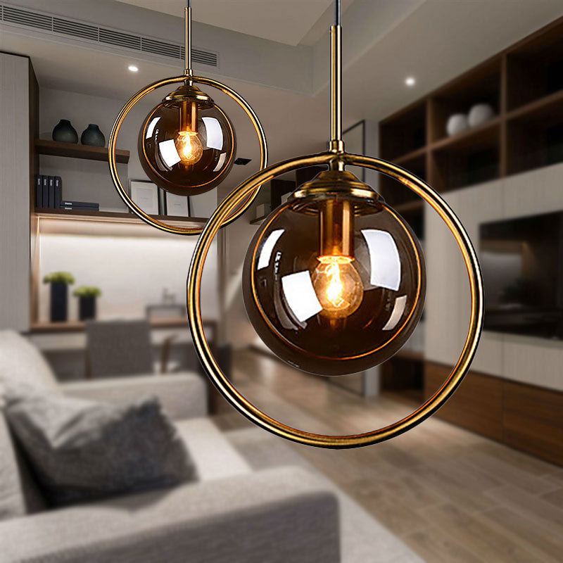 Amber/Smoke/Clear Glass Ball Pendant Lighting Post-Modernist 1 Light Ceiling Hung Fixture with Ring Frame Amber Clearhalo 'Ceiling Lights' 'Glass shade' 'Glass' 'Modern Pendants' 'Modern' 'Pendant Lights' 'Pendants' Lighting' 961878