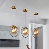 Amber/Smoke/Clear Glass Ball Pendant Lighting Post-Modernist 1 Light Ceiling Hung Fixture with Ring Frame Clearhalo 'Ceiling Lights' 'Glass shade' 'Glass' 'Modern Pendants' 'Modern' 'Pendant Lights' 'Pendants' Lighting' 961879