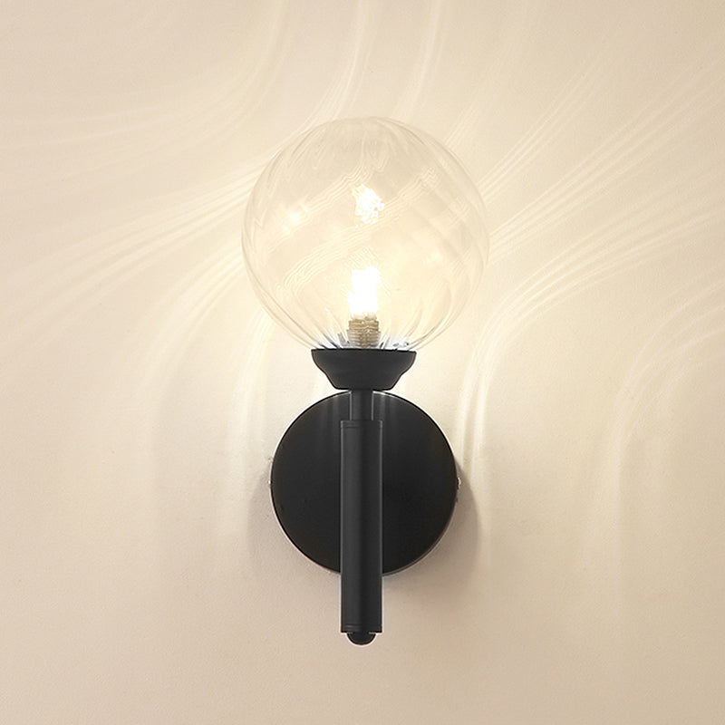 Clear Textured Glass Black Sconce Light Round 1-Light Modern Wall Lamp Fixture for Bedroom Clearhalo 'Art deco wall lights' 'Cast Iron' 'Glass' 'Industrial wall lights' 'Industrial' 'Middle century wall lights' 'Modern' 'Rustic wall lights' 'Tiffany' 'Traditional wall lights' 'Wall Lamps & Sconces' 'Wall Lights' Lighting' 968935