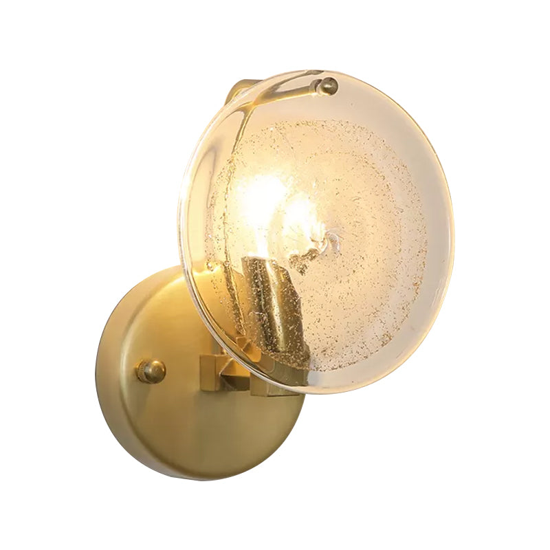 Metal Round Sconce Lamp Postmodern 1 Light Wall Mounted Light Fixture in Gold with Clear Glass Shade Clearhalo 'Cast Iron' 'Glass' 'Industrial' 'Modern wall lights' 'Modern' 'Tiffany' 'Traditional wall lights' 'Wall Lamps & Sconces' 'Wall Lights' Lighting' 982120