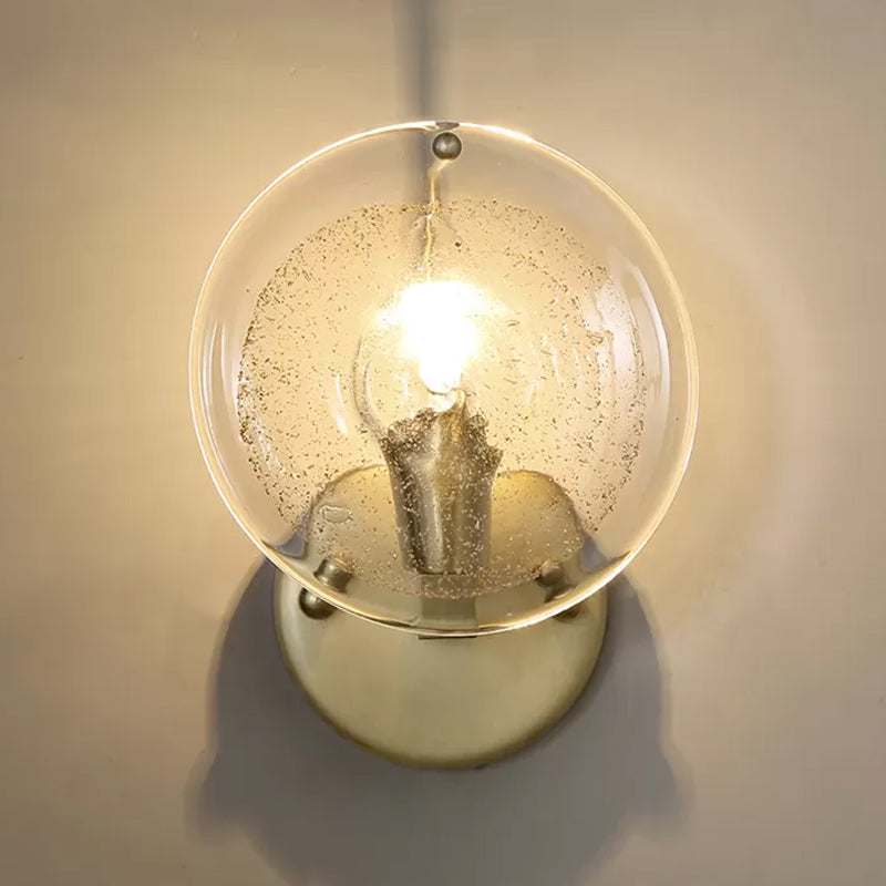 Metal Round Sconce Lamp Postmodern 1 Light Wall Mounted Light Fixture in Gold with Clear Glass Shade Clearhalo 'Cast Iron' 'Glass' 'Industrial' 'Modern wall lights' 'Modern' 'Tiffany' 'Traditional wall lights' 'Wall Lamps & Sconces' 'Wall Lights' Lighting' 982121