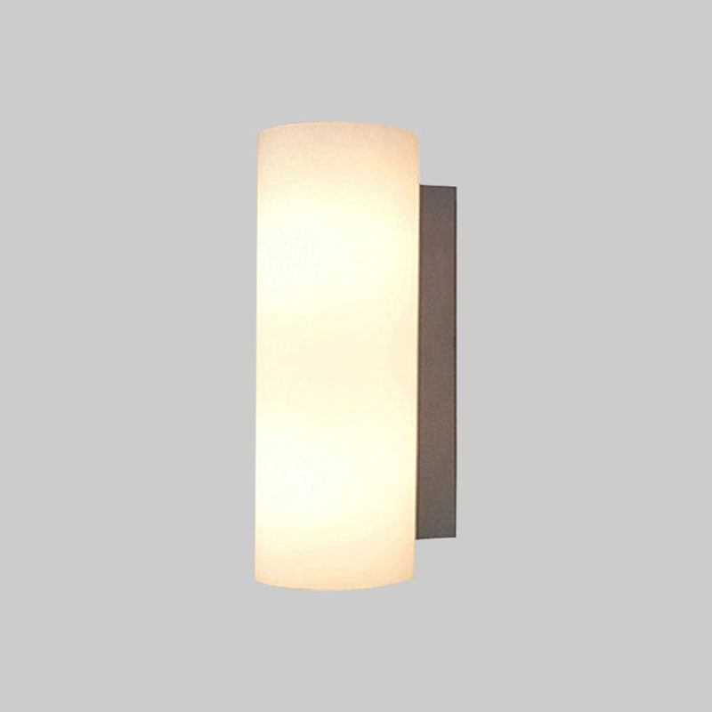 Cylindrical Bedroom Sconce Lighting White Glass 1 Light Modernist Wall Mount Light Clearhalo 'Cast Iron' 'Glass' 'Industrial' 'Modern wall lights' 'Modern' 'Tiffany' 'Traditional wall lights' 'Wall Lamps & Sconces' 'Wall Lights' Lighting' 991279